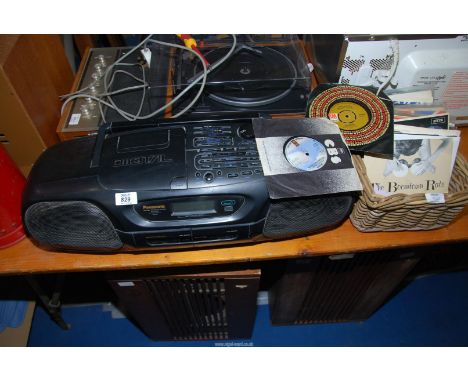 A Panasonic tape and CD player and a basket of LP's, The Boomtown Rats, The Carpenters, The Eagles etc.