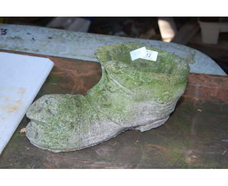 A concrete boot planter.