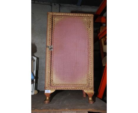 A Lloyd loom style bedside cabinet.