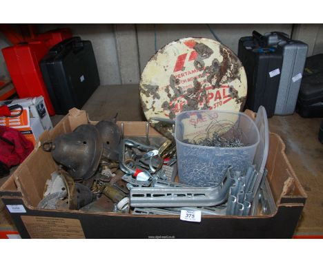 A box of miscellaneous metal items, light shades, enamel sign, chain, brackets, etc.
