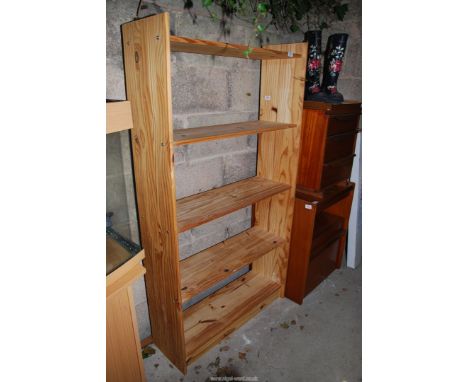 A pine shelf unit, 33" x 60 1/2" x 11".