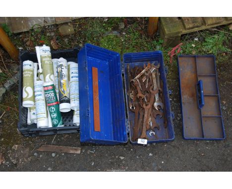 A tool box and contents plus a tray of "Heritage Putty" wood glue and a fuel can.