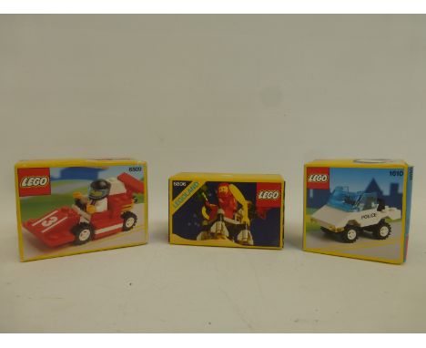Three boxed Lego set - 6806 (1985) Surface Hopper, 1610 (1991) police car and 6509 (1991) red racer, all unopened.
