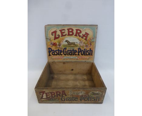 A Zebra Grate Polish wooden dispensing box with a bright label inside.