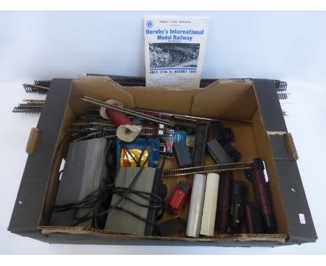 An assortment of 00 gauge carriages, plank wagons etc. including a G.W.R. 4589 engine and a "Duchess of Sutherland" locomotiv