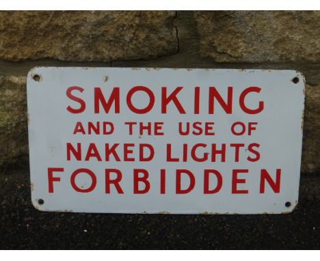 A small rectangular red and white enamel sign - "Smoking and the use of Naked Lights Forbidden", 13 x 7".
