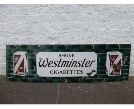 A Westminster Cigarettes part pictorial enamel sign with images of two packets against a faux green tile background, 60 x 18"