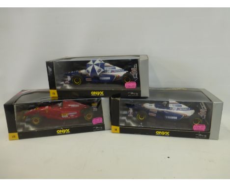 Three boxed Onyx Formula 1 1:18 scale models, a Ferrari 412 T2 Gerhard Berger, a Williams Renault FW17 David Coultard and a W