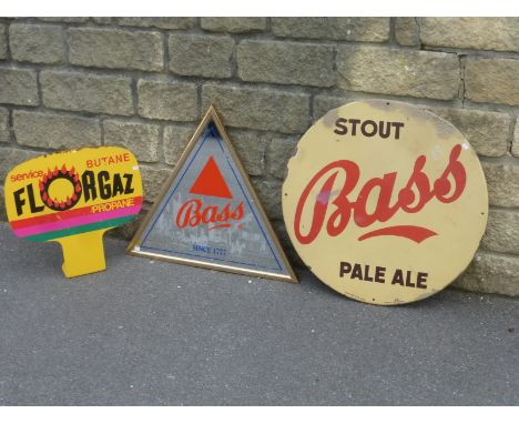 A Bass Stout Pale Ale circular enamel sign, 25" diameter, a reproduction triangular Bass mirror and a Butane "Florgaz" double
