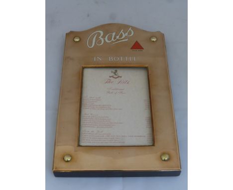 A good quality Bass beer polished copper and enamel lettered wall mounted menu holder containing a "traditional bill of fare"