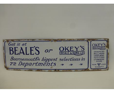 A narrow blue and white enamel sign advertising Beale's or Okey's of Bournemouth, 20 x 16".