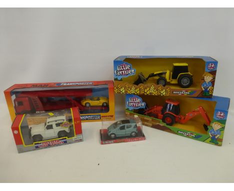 A Britain's tractor and loader, a Backhoe loader, a Toyota Land Cruiser, a Man Car Transporter and a Team Master M.B.A. Class