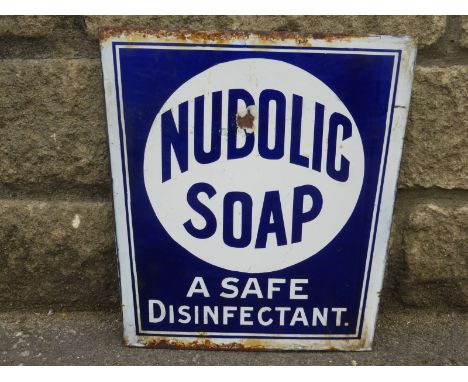A double sided enamel chair back advertising to one side Watson's Matchless Cleanser and Nubolic Soap to the other.