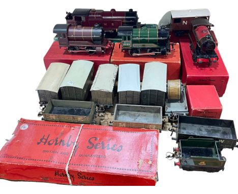 Collection of Hornby 'O' Gauge Clockwork Model Railway including four models of steam engines, wagons, etc.