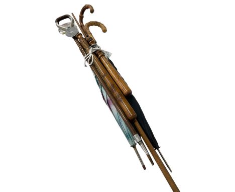 Collection of umbrellas, shooting stick, truncheons, etc.