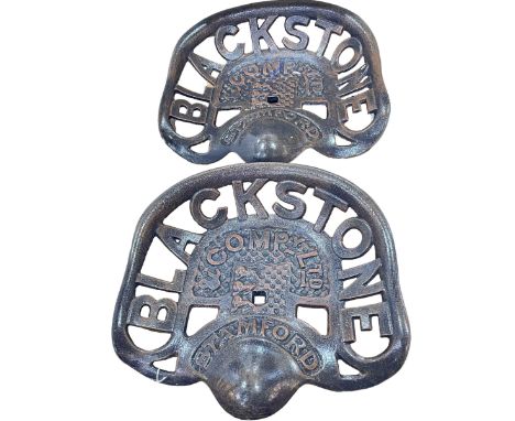 Two cast metal models of Blackstone Company Ltd tractor seats.