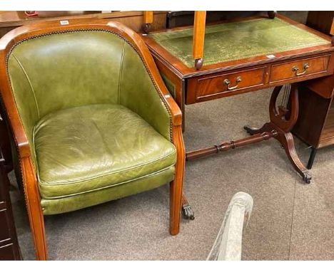 Green leather occasional armchair and mahogany two drawer sofa table (2).