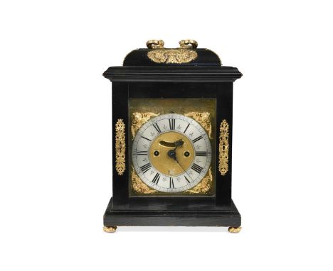 An ebonised table clock signed William Tomlinson, London, circa 1700,  the gilt metal mounted case with folding brass figural