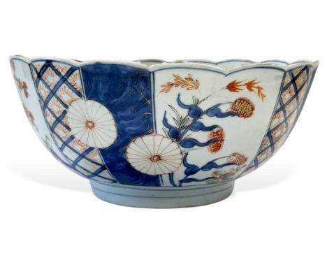 A Chinese Imari porcelain large fruit bowl, circa 1720-40, with scalloped rim and lobed body, the exterior painted with alter