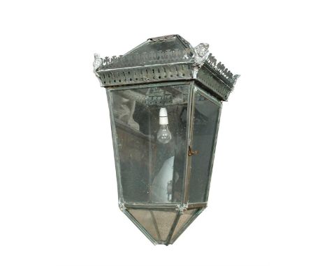 A copper and glazed lantern, first half 19th century, with suspension ring, a pierced cresting and four tapering sides85 x 45