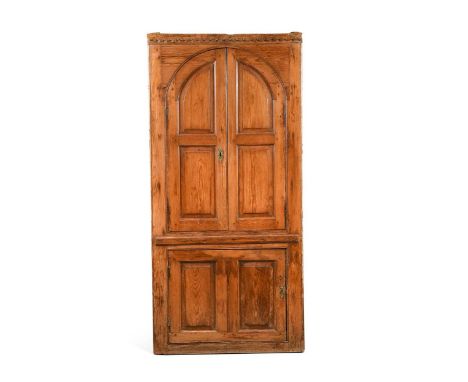 A George III barrel back pine corner cupboard, with pair of arched panelled doors over a single cupboard door193 x 92 x 48cmS
