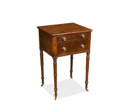 A Regency mahogany side table, the rounded rectangular top above two drawers and raised on slender turned legs with original 