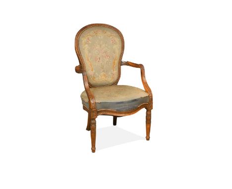 A walnut open armchair, 19th century, the cartouche shaped back with rope twist edge on down swept arms, serpentine seat rail