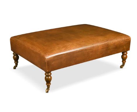 A faux-crocodile leather upholstered stool, modern, the rectangular top on turned legs and castors38 x 108 x 78cm