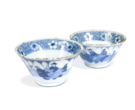 A near pair of Chinese blue and white porcelain flared circular bowls, Kangxi Emperor (1662-1722), externally painted with th