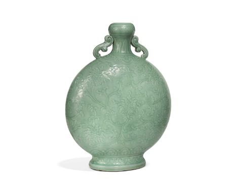 A Chinese celadon glazed and carved large moonflask, Qing Dynasty, 18th century, of soft jade colour, carved in low relief wi