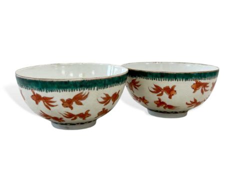 A pair of Chinese porcelain fish and wave bowls, Guangxu mark but probably Republic,  each internally with a solitary goldfis