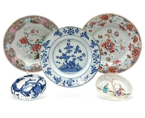 A Chinese famille rose porcelain plate, Qing Dynasty, Qianlong, circa 1740,  painted with peonies and orchids, 23cm diameter;