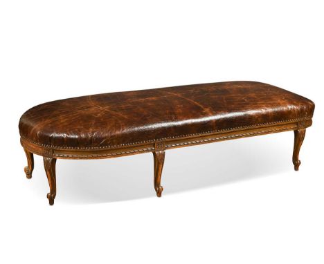 A Victorian leather covered stool, of rounded rectangular form, with moulded frieze on cabriole legs39 x 103 x 163cm