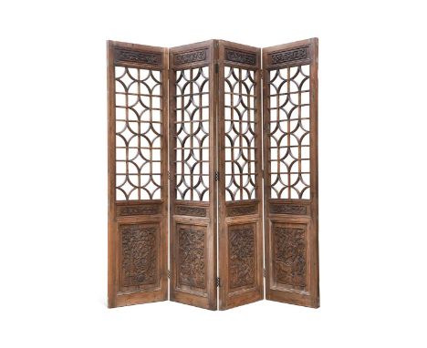 A Chinese carved wood four fold screen, 20th century, the top with open pierced geometric panels above scenes depicting anima