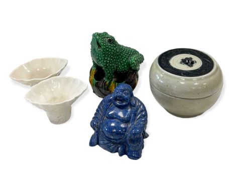 A Chinese egg and spinach glazed porcelain toad, Qing Dynasty, 19th century, modelled standing on a lily pad, 12.5cm high; to