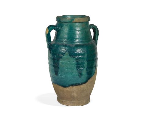 A Kashan turquoise-glazed storage jar, Iran, probably 12th-14th century, of two-handled shouldered ovoid shape, three-quarter