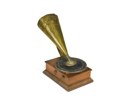 A Stollwerck Patent Phonograph, early 20th century, the rectangular oak base with maker's plate and egg and dart moulded bord
