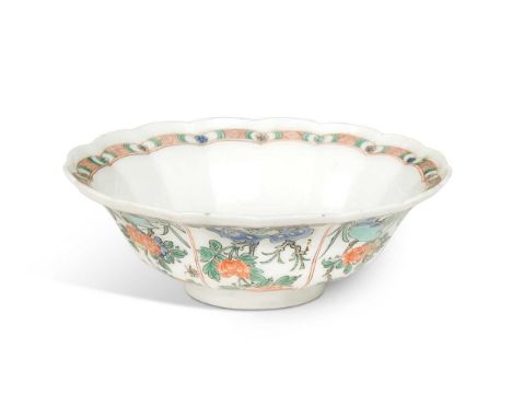 A Chinese famille verte lobed circular bowl, Kangxi Emperor (1662-1722), decorated with peonies en rocaille and insects7 x 19