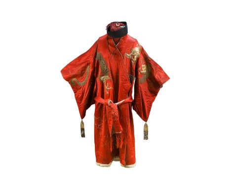 A Korean ceremonial silk dress, circa 1920s, the rich red ground embroidered in gold stitch with dragons and clouds, the slee