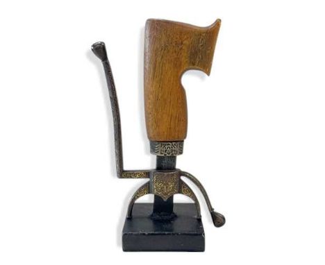 A Moroccan Nimcha sword (sa'if) handle and fittings, 19th century, the saw-shape rhino horn handle with gold inlaid steel qui