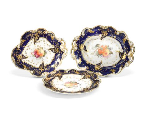 A Staffordshire dessert service, 19th century, the centres painted with fruit, within shaped blue and gilt borders, comprisin