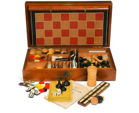 A mahogany games compendium box, 19th century, the rectangular lid enclosing horse racing figures, chess and draughts pieces,