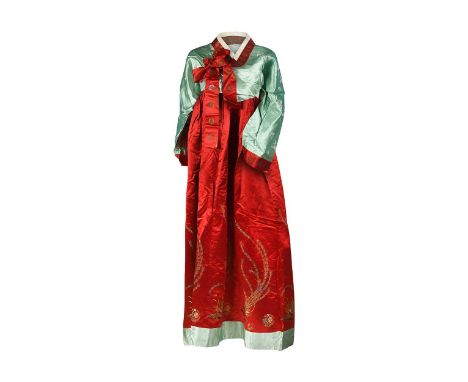 A Korean ladies Hanbok dress, circa 1920s, the mint ground wrap around jacket embroidered with emblems and flowers, edged in 