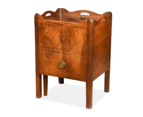 A George III mahogany tray-top night cupboard, the shaped gallery above a pair of chequer-strung doors and with single drawer