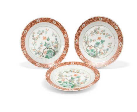 A set of seven Chinese famille verte plates, Kangxi Emperor (1662-1722), with bracketed rims and fluted, painted with azure w