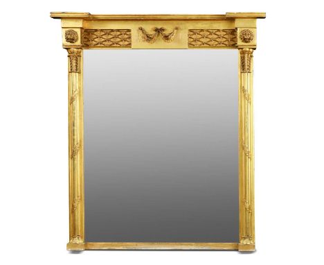 A Regency giltwood overmantel mirror, the rectangular plate flanked by acanthus wrapped cluster column pilasters with lion ma