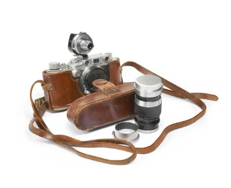 A Leica III camera, 1939, serial no. 324725, with Elmar f=5cm 1:3.5 and f=9cm 1:4 lenses, and viewfinder