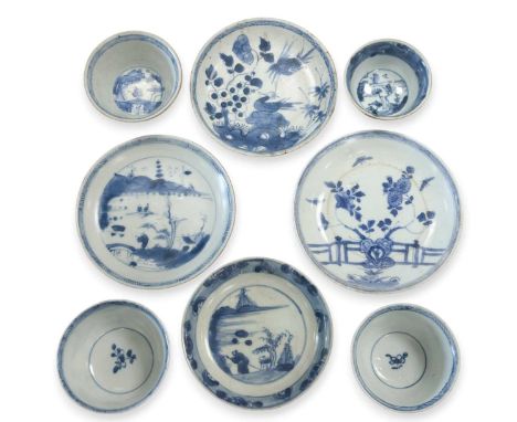 Four Chinese export blue and white tea bowls and saucers from the Ca Mau cargo, 18th century, decorated with garden scenesThe