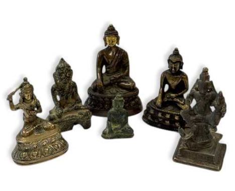 A Nepalese small copper alloy figure of Buddha, 18th/19th century, seated in meditation, gilded head, on a double-lotus base,