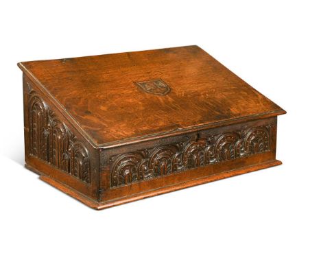 An oak bible box, 19th century, the slope front top bearing initials AH within a shield, opening to reveal three drawers, the